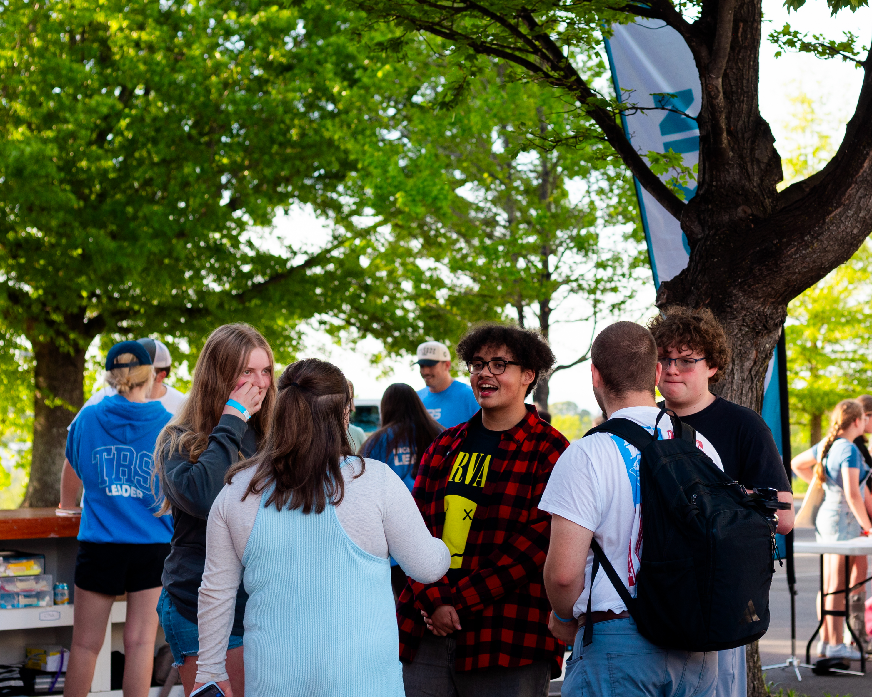 Students gathering near Thomas Road ministry signage